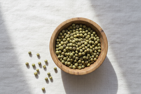 Green Peppercorns — wooden bowl